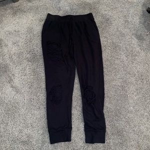 Black sweatpants with rips